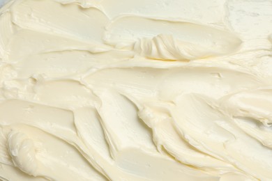 Photo of Texture of tasty butter as background, top view