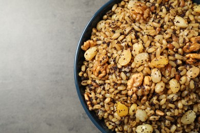 Photo of Traditional Christmas slavic dish kutia on grey table, top view