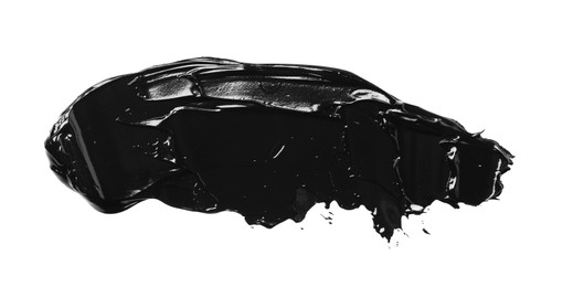 Photo of Smear of black glossy paint on white background, top view