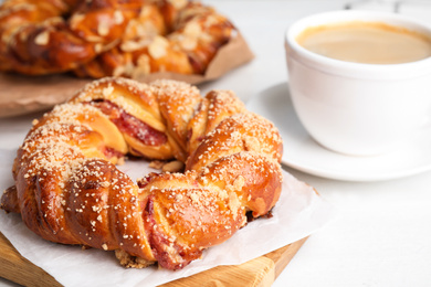 Delicious pastries and coffee on white table, closeup