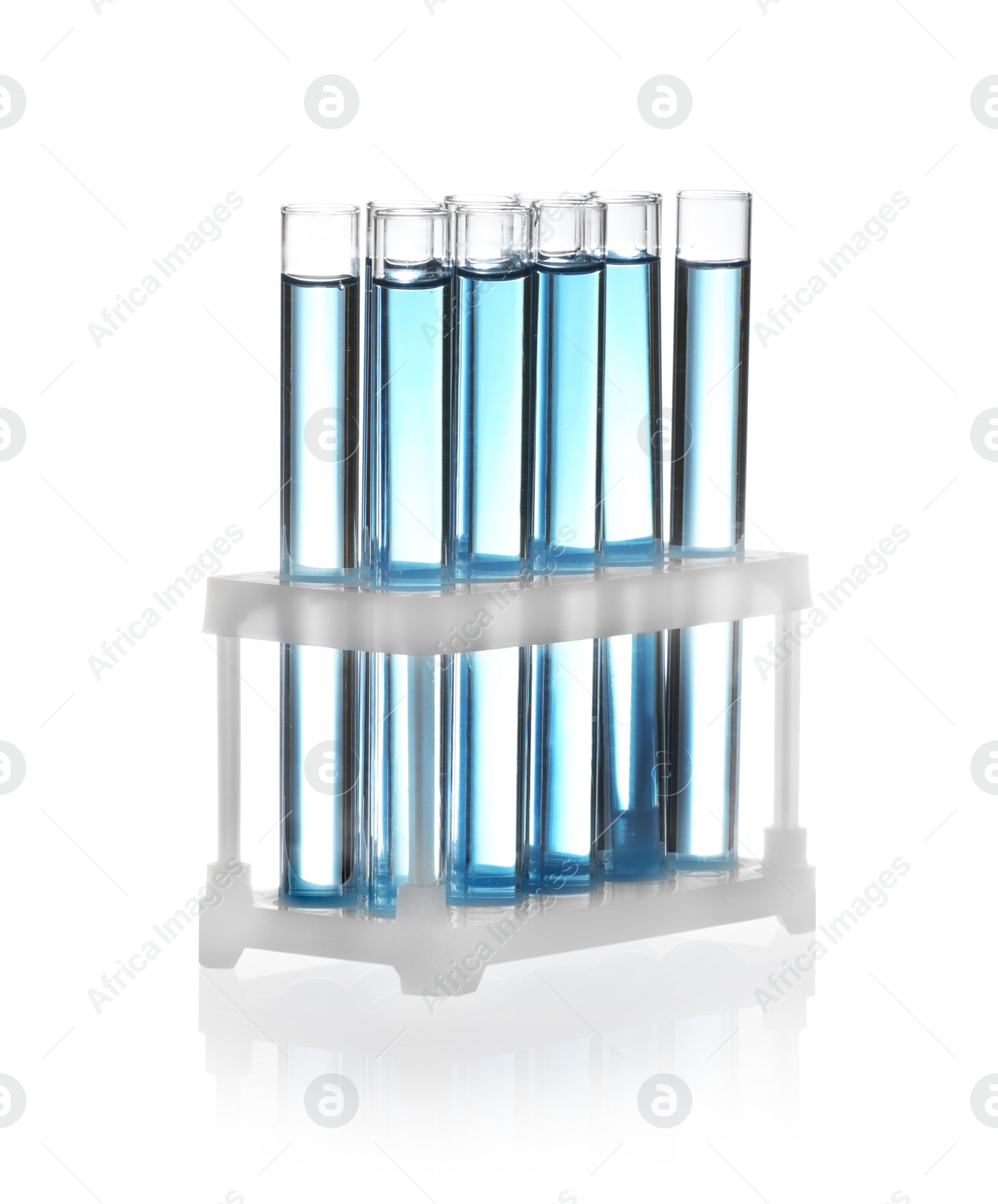 Photo of Test tubes with blue liquid isolated on white. Laboratory glassware