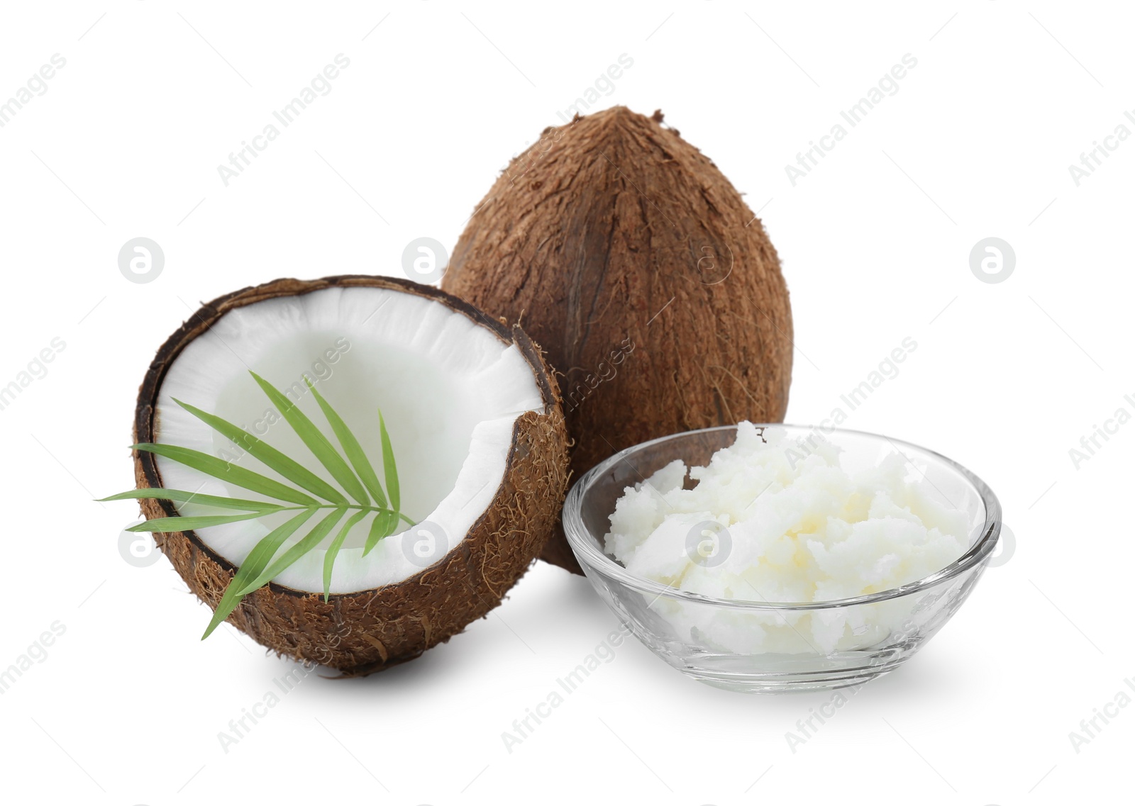 Photo of Organic coconut cooking oil, fresh fruits and leaf isolated on white