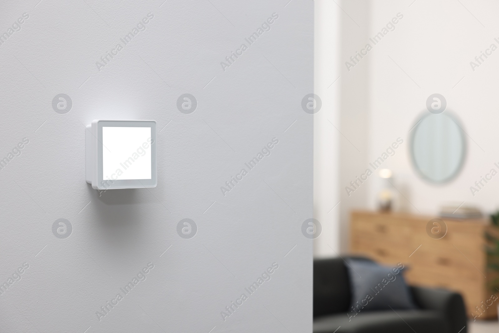 Photo of One thermostat on white wall indoors, space for text. Smart home system