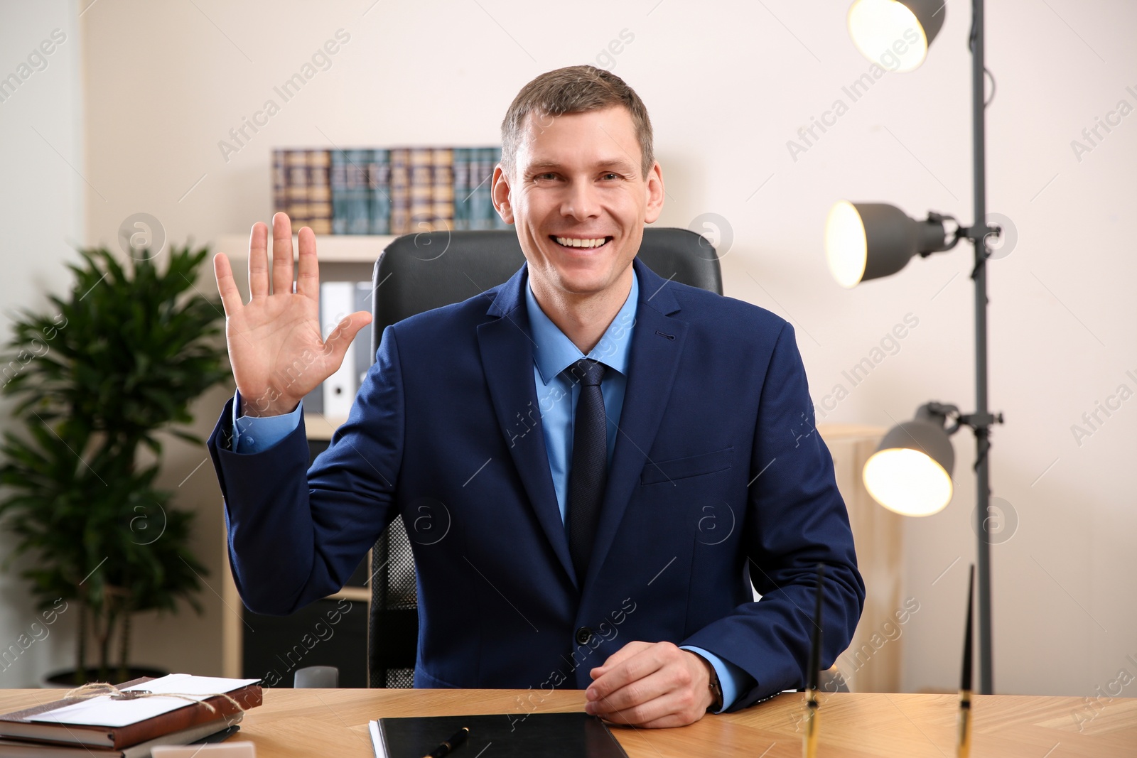 Photo of Man using video chat in office, view from web camera