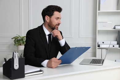 Photo of Human resources manager conducting online job interview via video chat on laptop