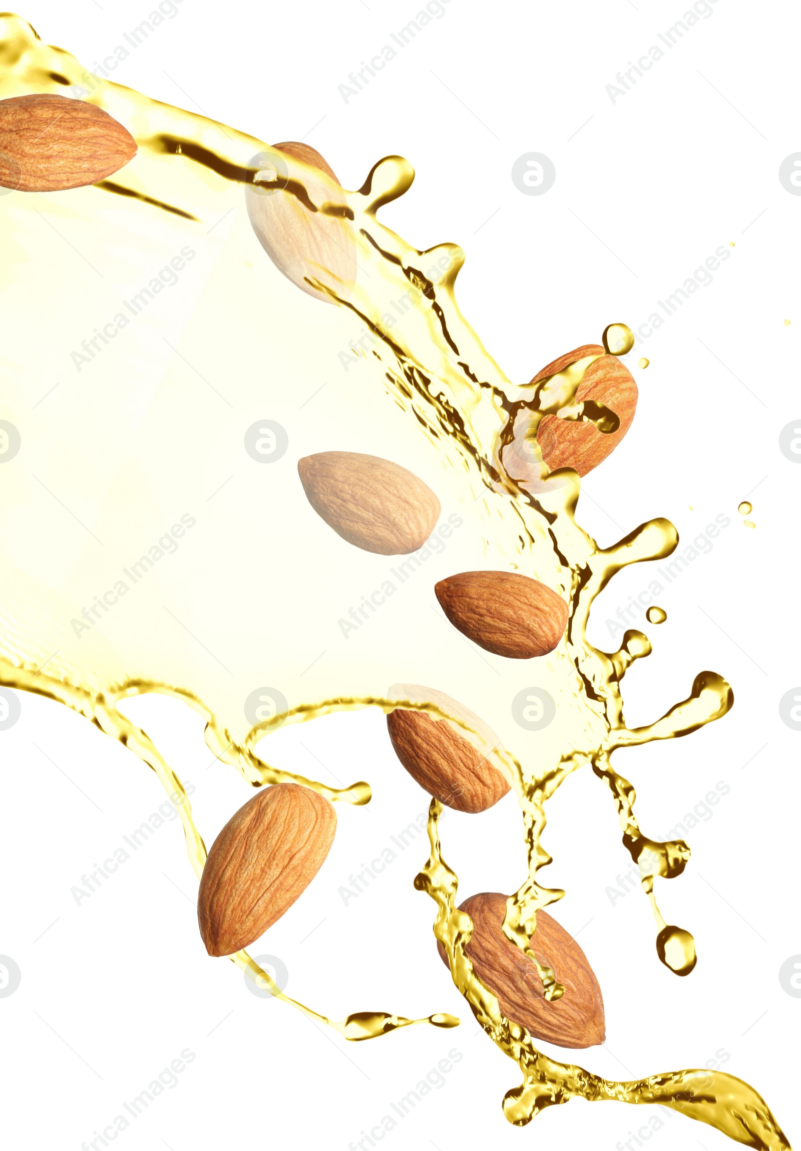 Image of Organic almond oil and tasty nuts flying on white background