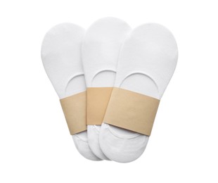 Photo of New pairs of cotton socks on white background, top view