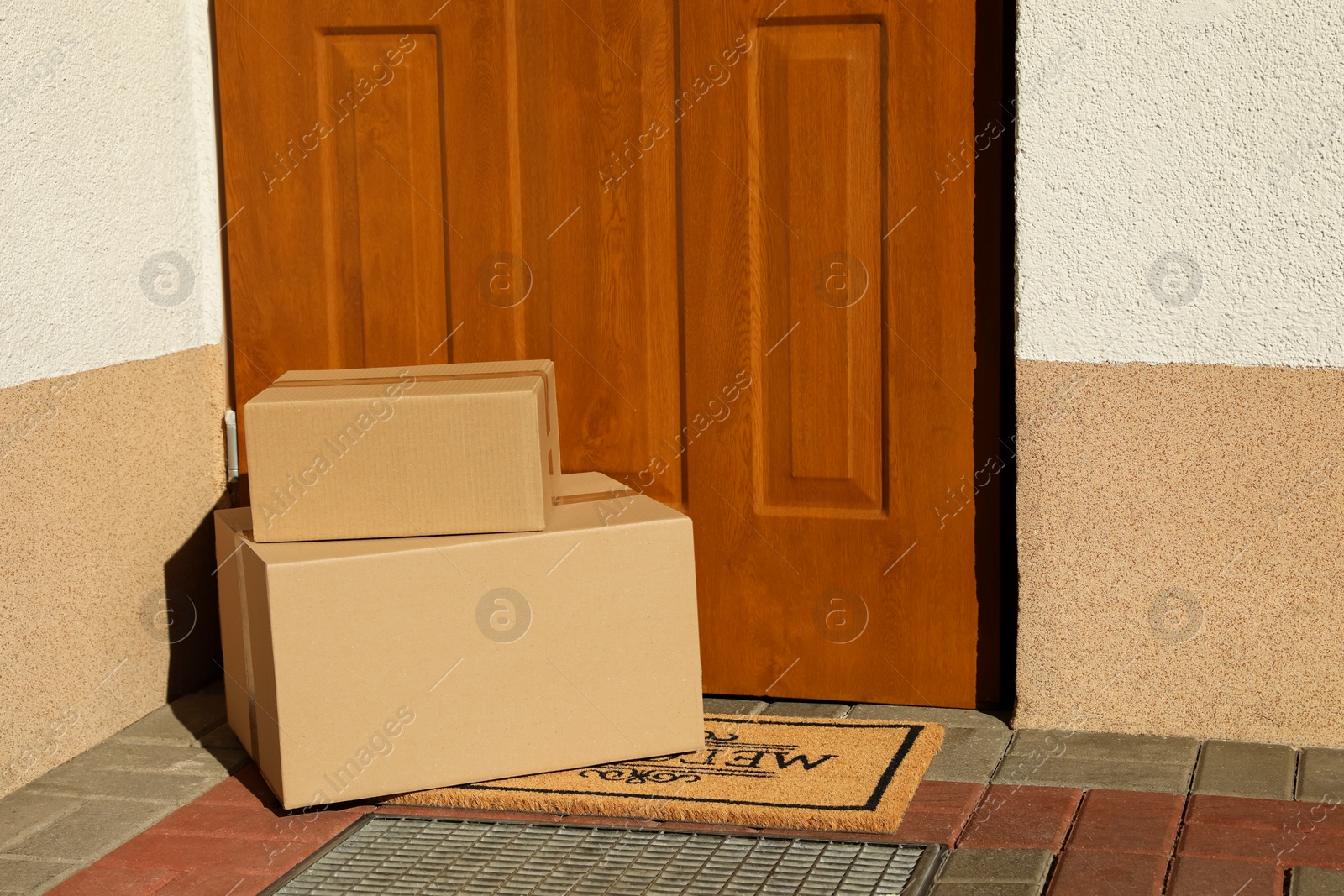 Photo of Parcels delivered on mat near front door