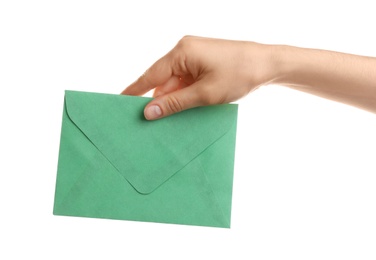 Woman holding green paper envelope on white background, closeup