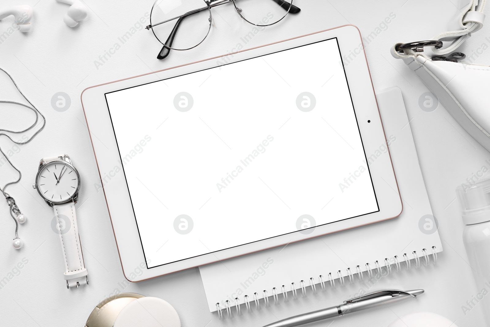 Photo of Flat lay composition with modern tablet on white background. Space for text