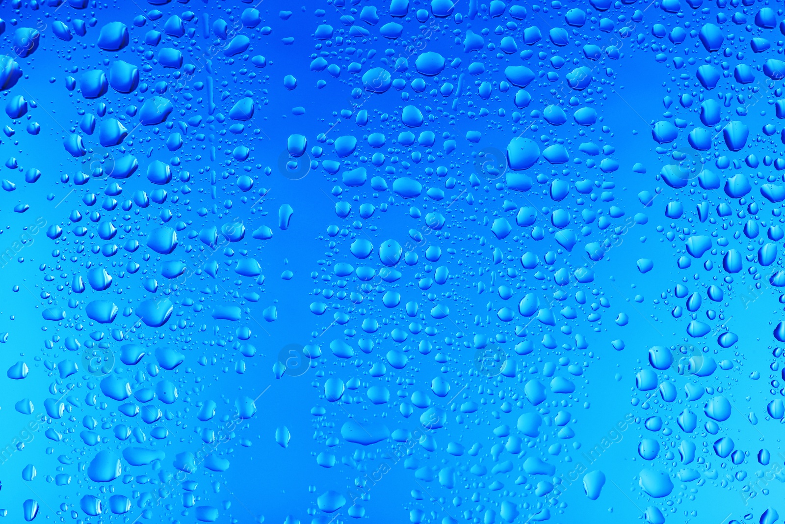 Photo of View of glass with water drops, closeup