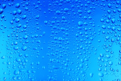 Photo of View of glass with water drops, closeup