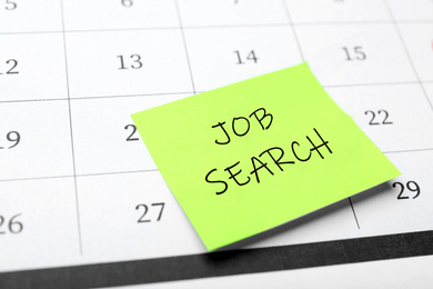 Image of Reminder note about job search on calendar, closeup