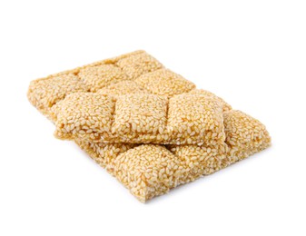 Tasty sesame kozinaki bars on white background