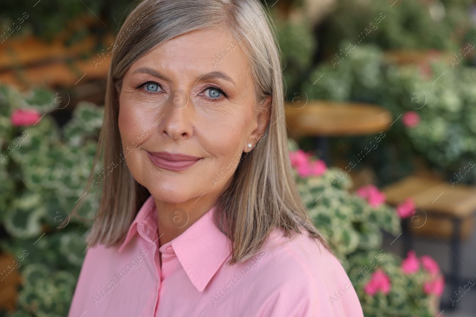 Photo of Portrait of beautiful smiling senior woman outdoors