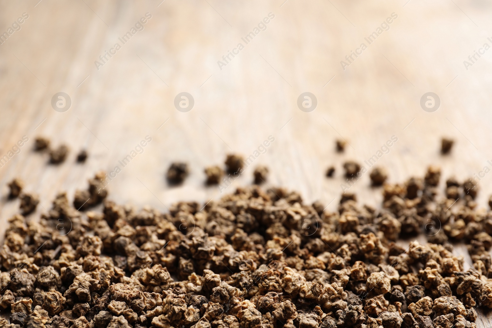 Photo of Raw beet seeds on wooden background, closeup. Vegetable planting