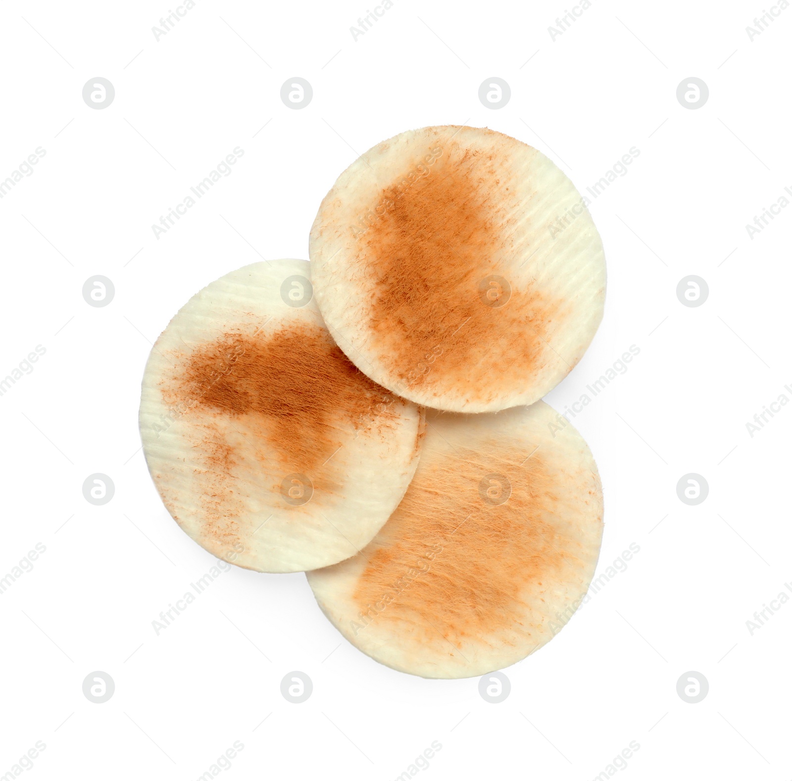 Photo of Dirty cotton pads after removing makeup on white background, flat lay