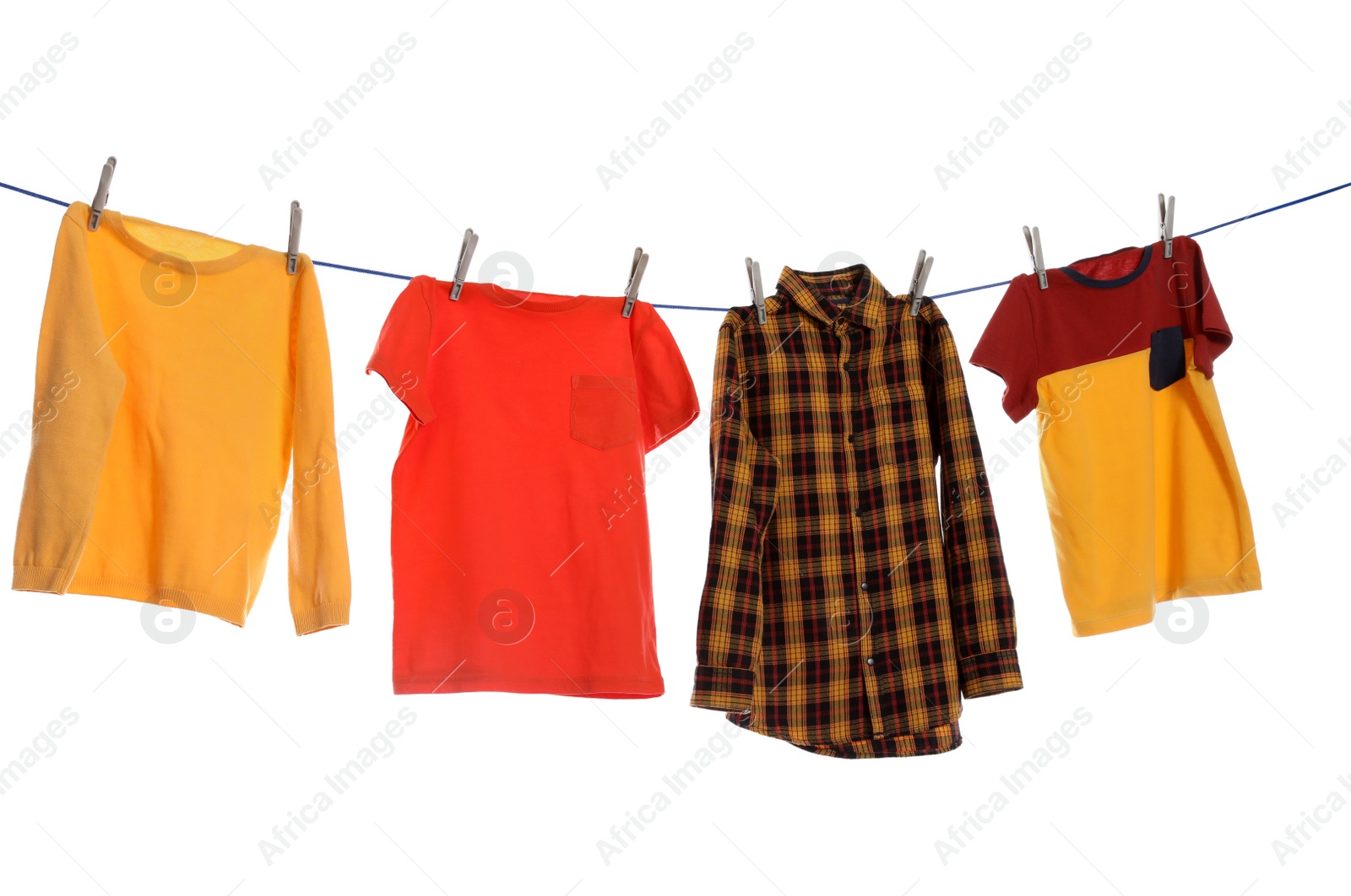 Photo of Different bright clothes drying on washing line against white background