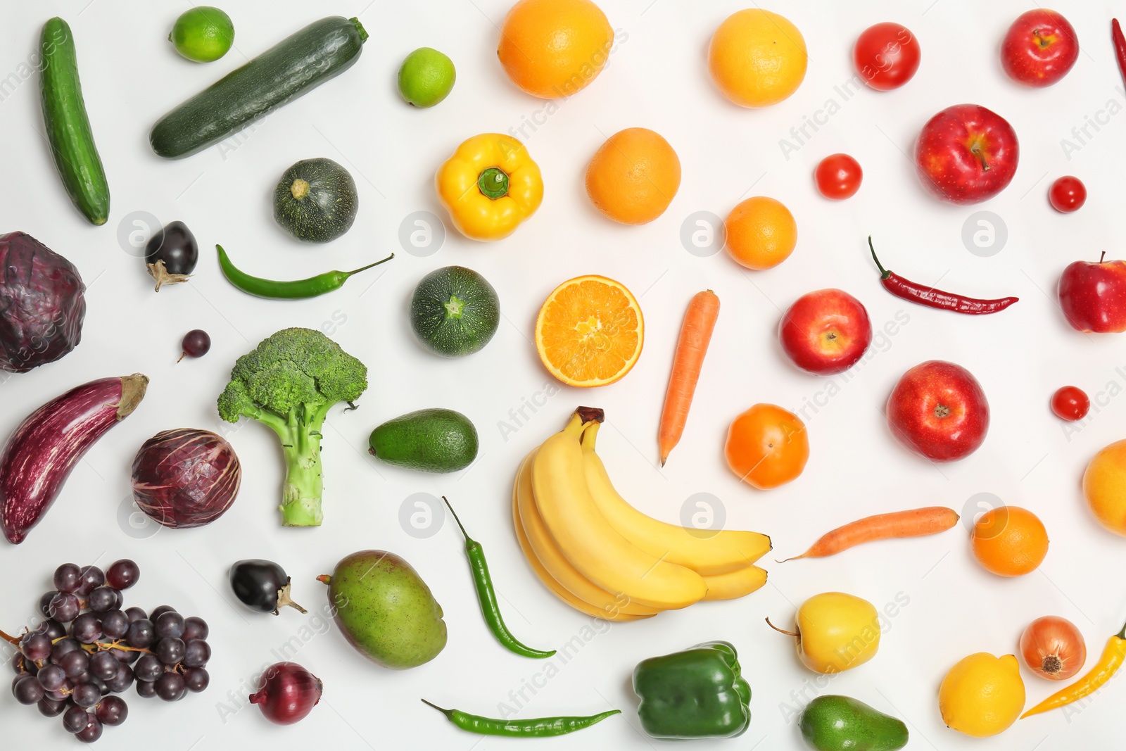 Photo of Rainbow composition with fresh vegetables and fruits on white background, flat lay