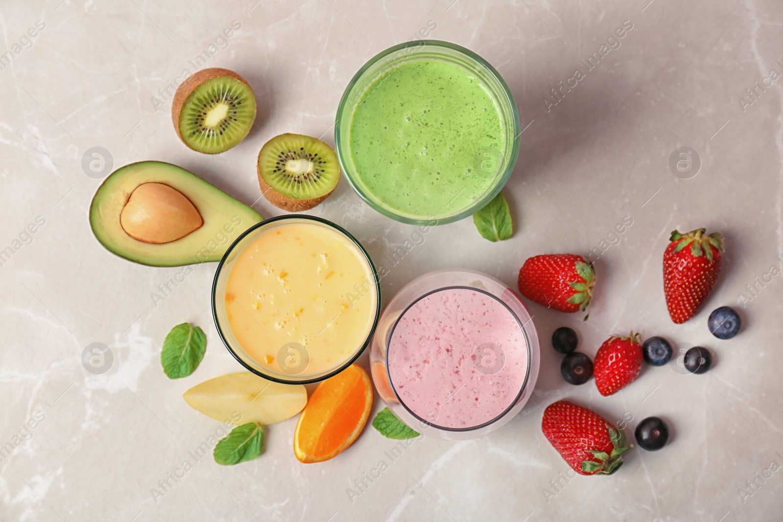 Photo of Flat lay composition with healthy detox smoothies and ingredients on light background