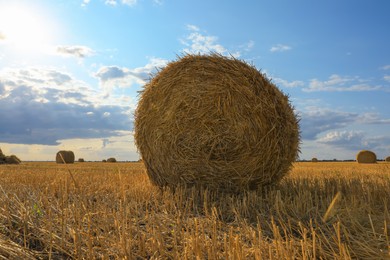 Beautiful view of agricultural field with hay bale