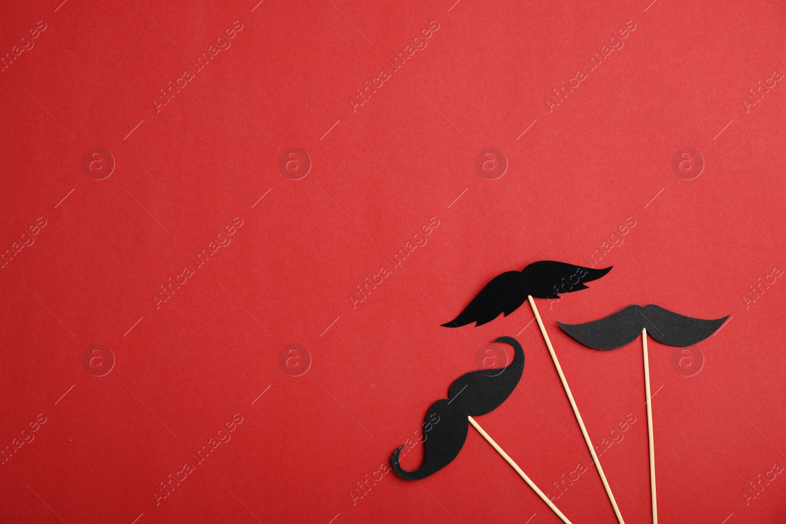 Photo of Flat lay composition with paper moustaches and space for text on color background. Happy Father's Day