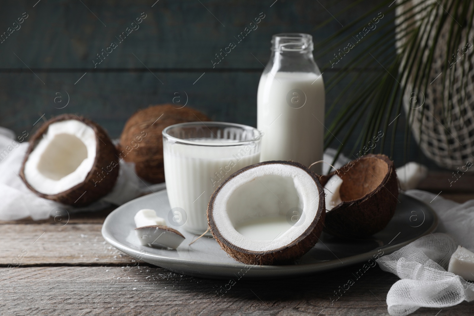 Photo of Composition with coconut milk on wooden table