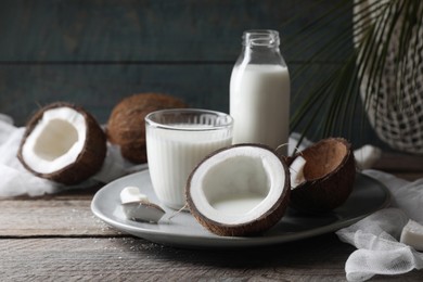 Composition with coconut milk on wooden table