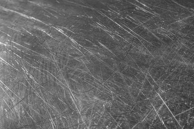 Texture of scratched metallic surface as background, closeup