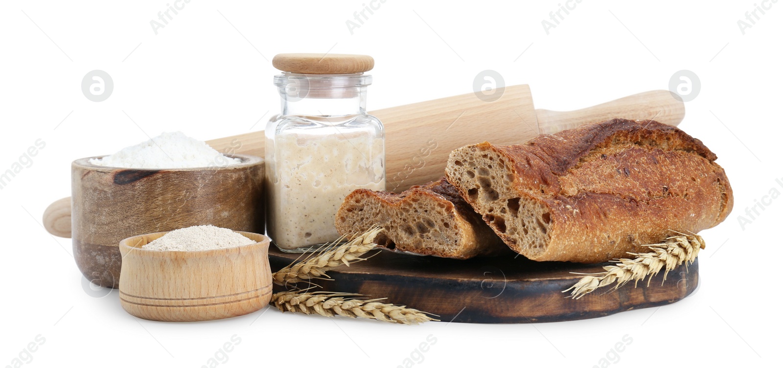 Photo of Freshly baked bread, sourdough and other ingredients on white background