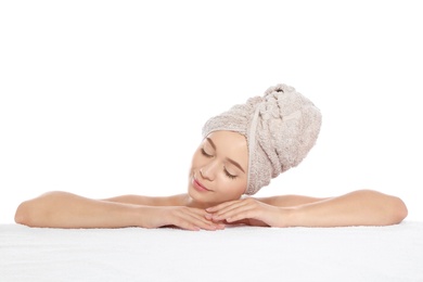 Portrait of young pretty woman with towel on white background