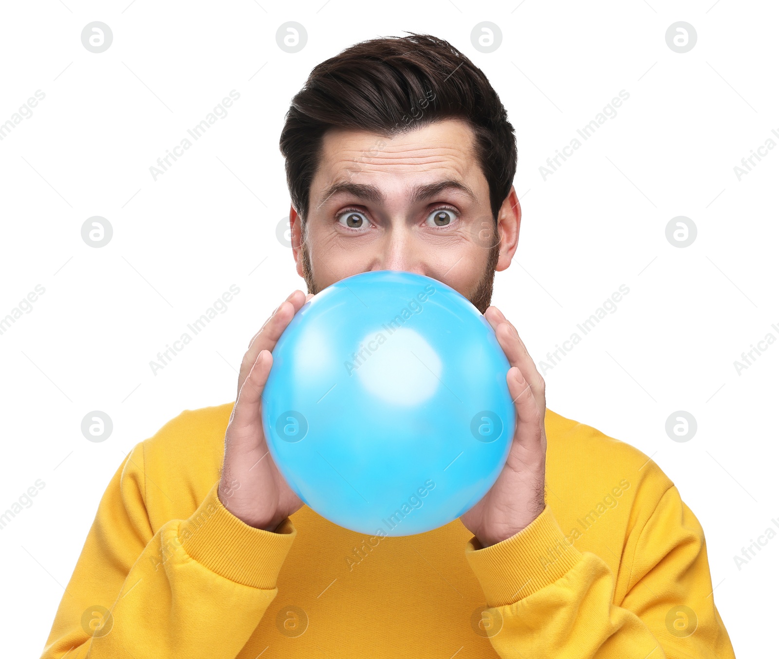 Photo of Man inflating light blue balloon on white background