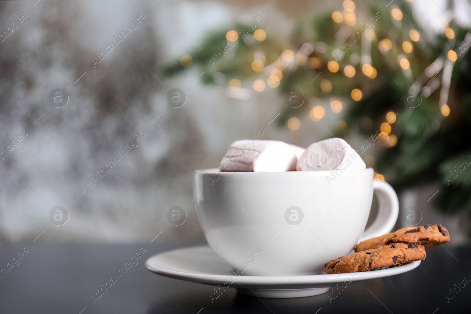 Photo of Cup of aromatic cacao with marshmallows and cookies on table, closeup. Space for text