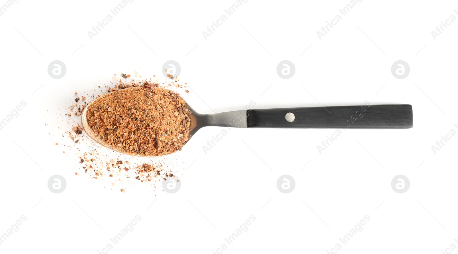 Photo of Spoon of ground pepper isolated on white, top view