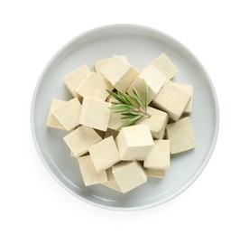 Photo of Plate with delicious tofu and rosemary isolated on white, top view