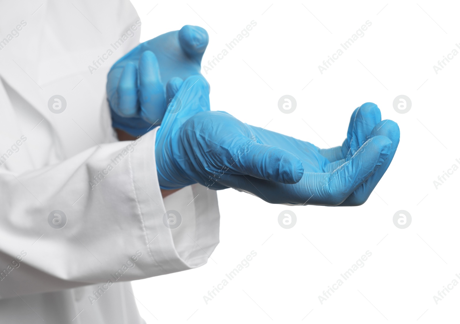 Photo of Doctor wearing light blue medical gloves on white background, closeup