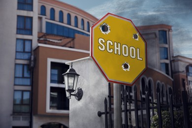 Image of School sign damaged with shooting near building