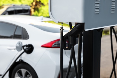 Electric vehicle charging station outdoors. Modern technology