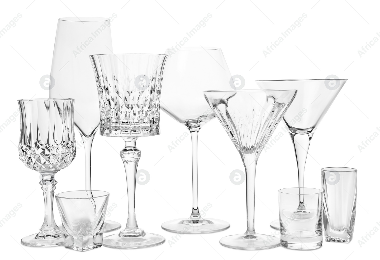 Photo of Different elegant empty glasses isolated on white