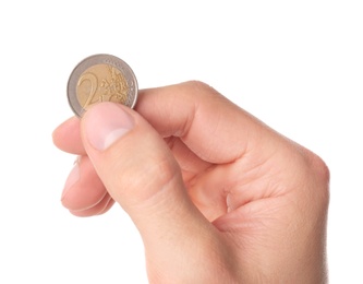 Photo of Man holding coin in hand on white background, closeup