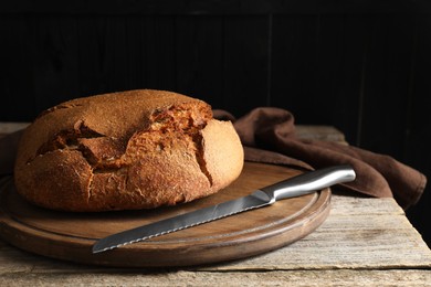 Photo of Freshly baked sourdough bread on wooden table