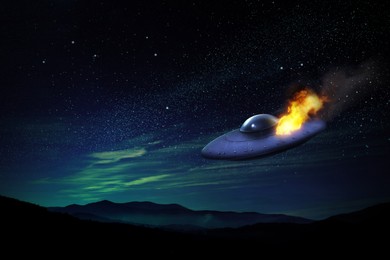 Image of UFO. Damaged alien spaceship falling. Extraterrestrial visitors