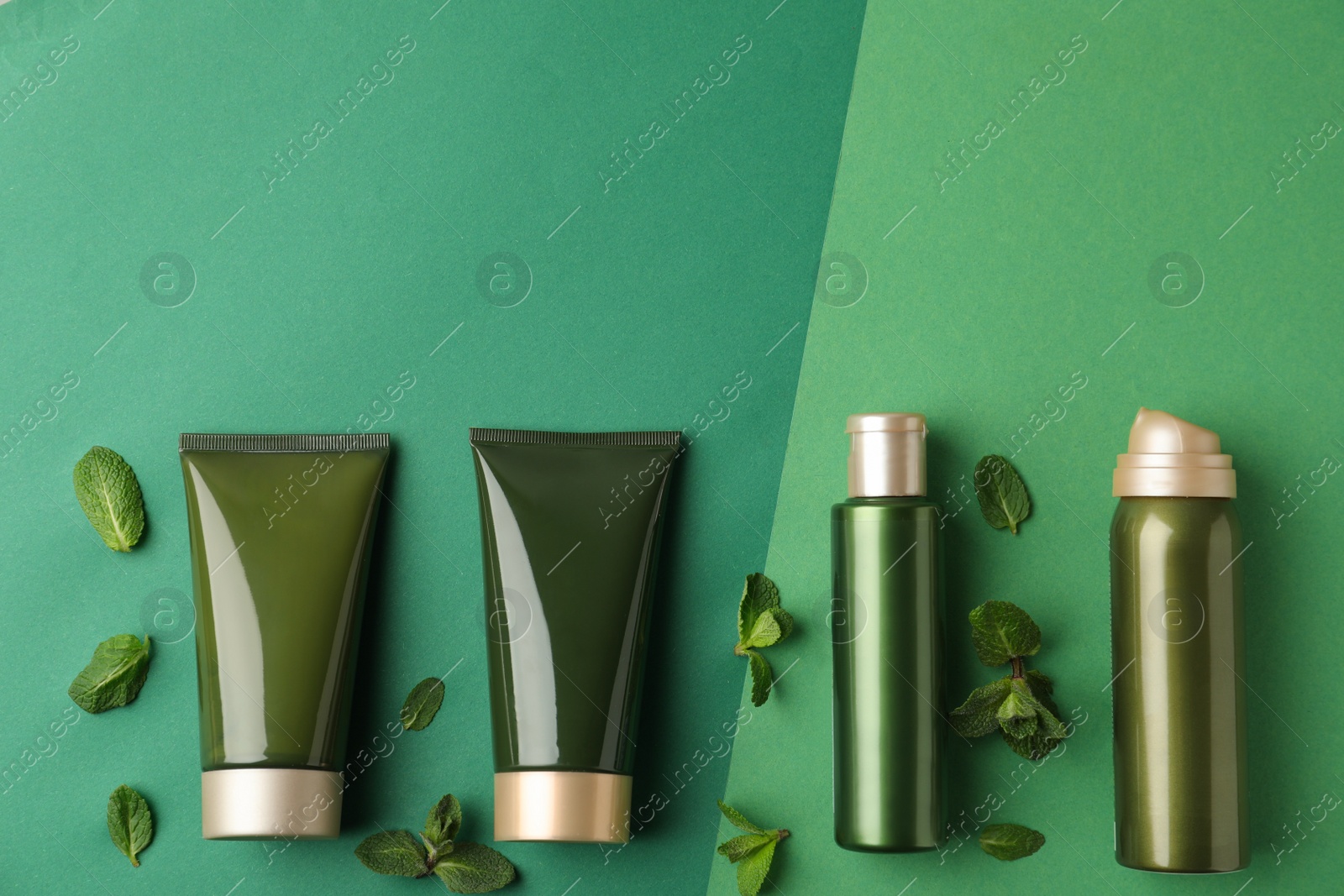 Photo of Flat lay composition with cosmetic products on green background. Space for text