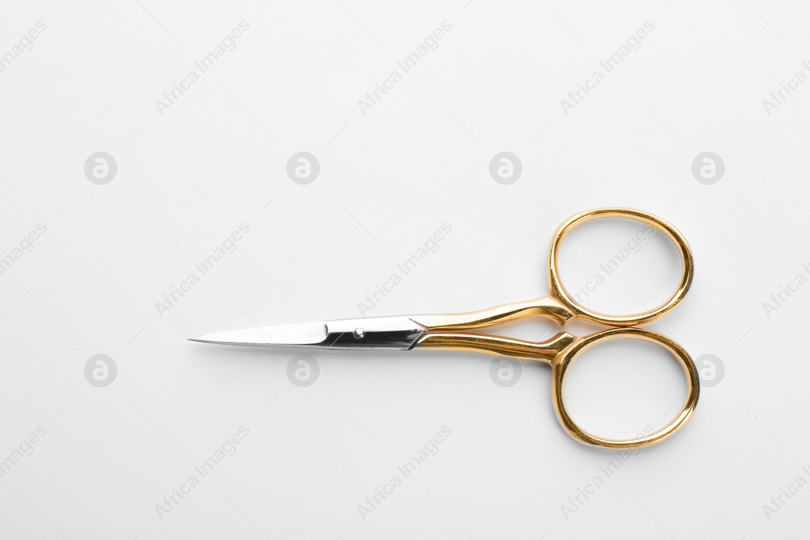 Photo of Pair of sharp sewing scissors on white background