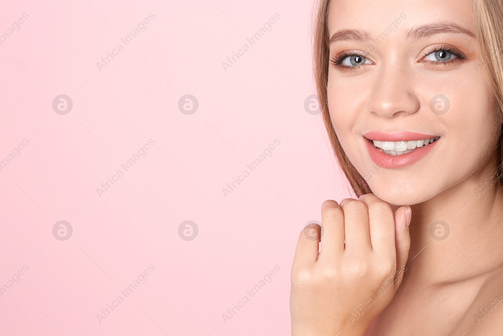 Photo of Portrait of beautiful young woman with natural makeup on color background. Space for text