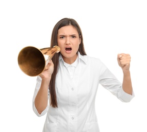Young female doctor using megaphone on white background
