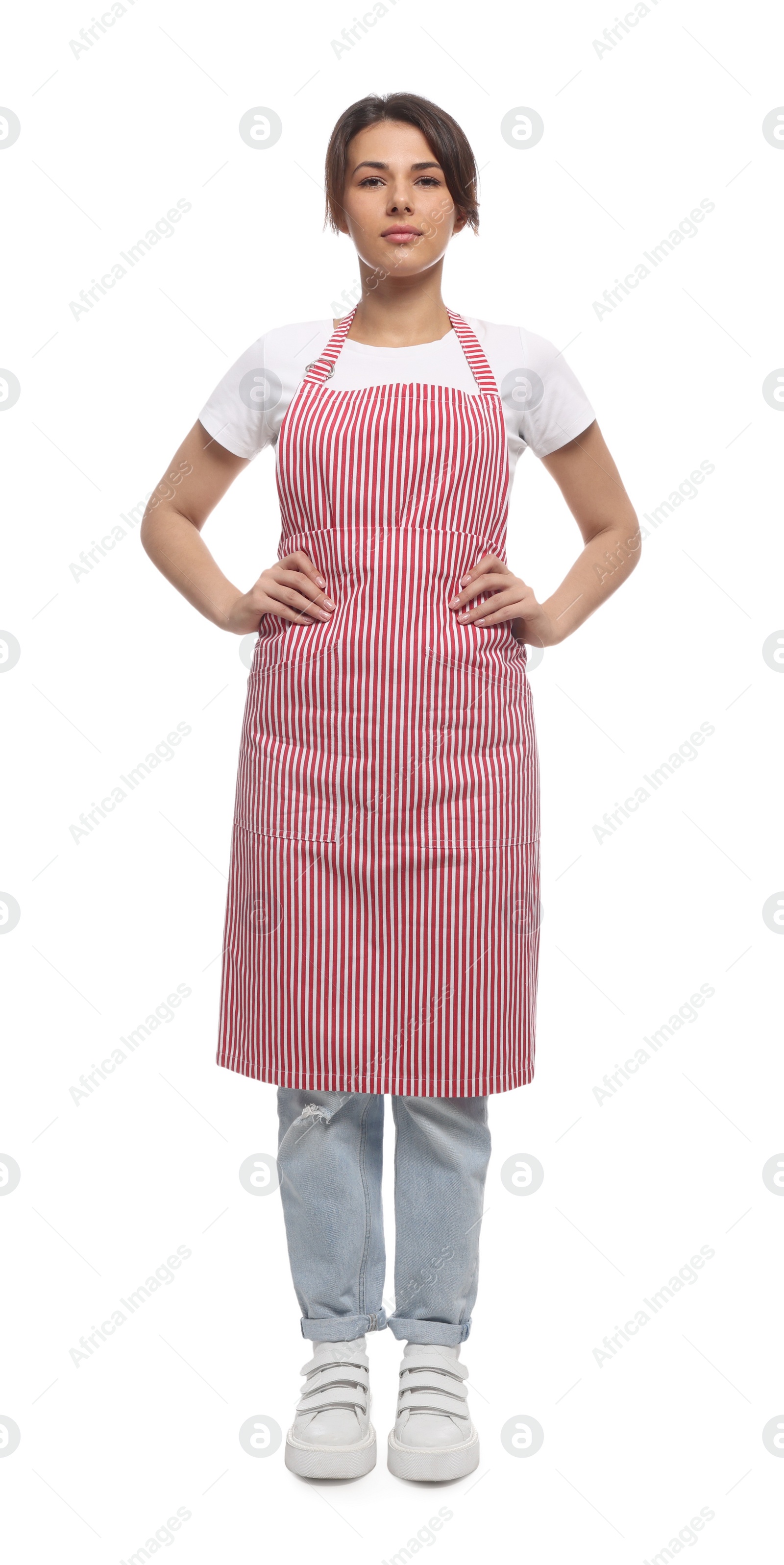 Photo of Young woman in red striped apron on white background