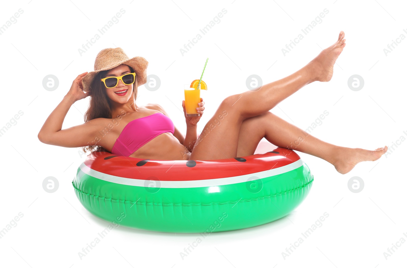 Photo of Beautiful young woman with inflatable ring and glass of cocktail on white background