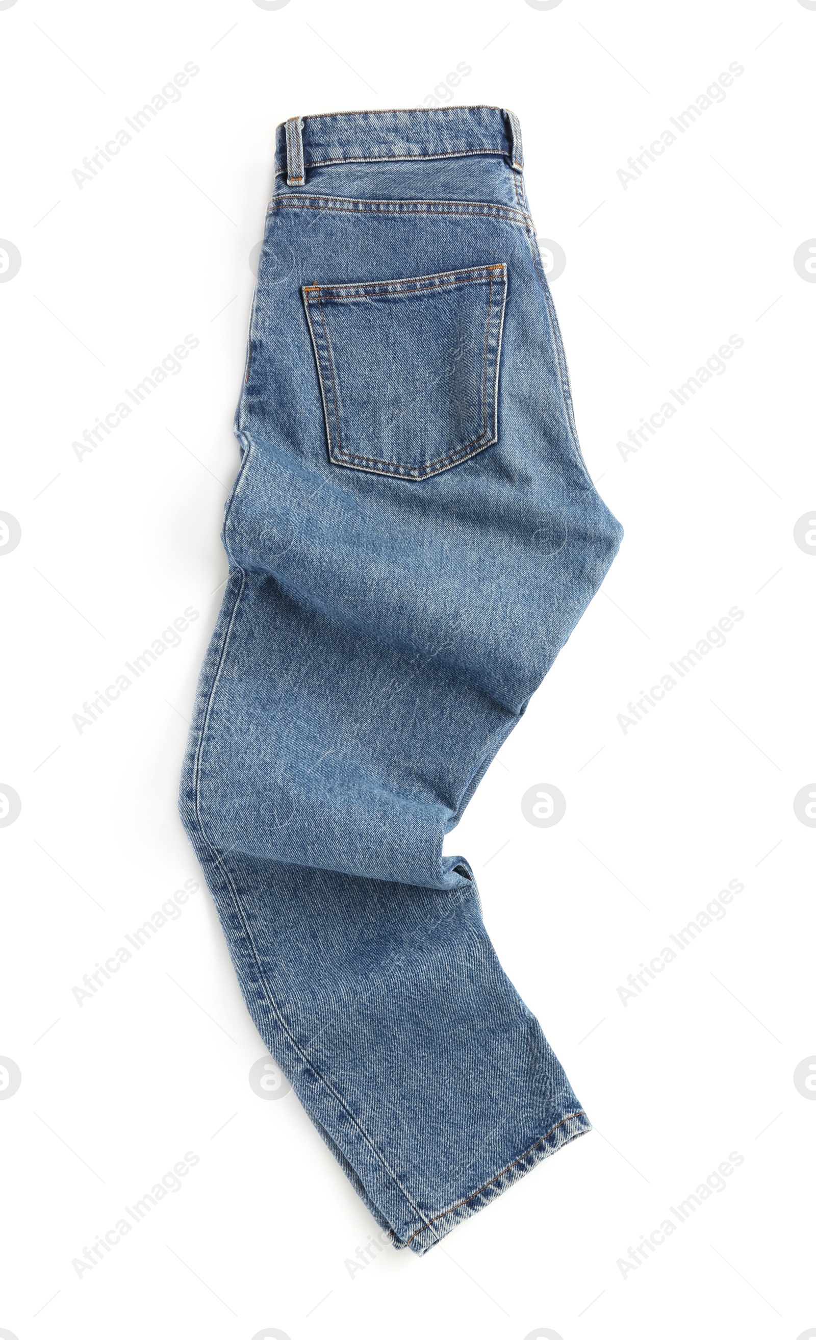 Photo of Rumpled blue jeans isolated on white, top view. Stylish clothes