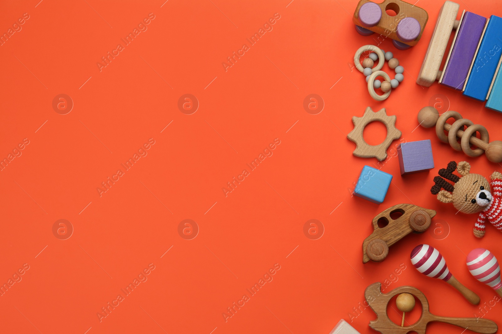 Photo of Different children's toys on orange background, flat lay. Space for text